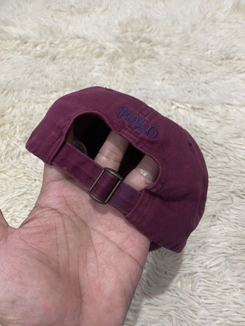 Polo Ralph Lauren Maroon Baseball Cap (Category: Caps & Hats) located in Manila. Submitted by switchcity (Listing ID 1467878139, Image 3). Description: - Brand: Polo Ralph Lauren - Color: Maroon with blue embroidered pony logo - Material: 100% breathable cotton - Details: 'POLO' embroidered above the back strap - Closure: Adjustable metal buckle for a custom fit - Sizing: One size fits all - Origin: Made in Cambodia.