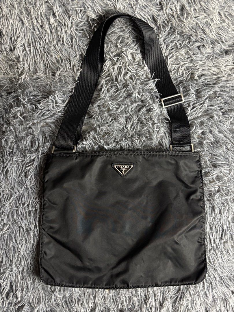 Prada Black Nylon Crossbody Messenger Bag (Category: Luxury Bags & Wallets) located in Manila. Submitted by hippiesph (Listing ID 1467860587, Image 1). Description: Prada nylon crossbody bag Authentic Still in great condition Honest issue : na putol puller pero working smoothly Price: 6,500 + sf.