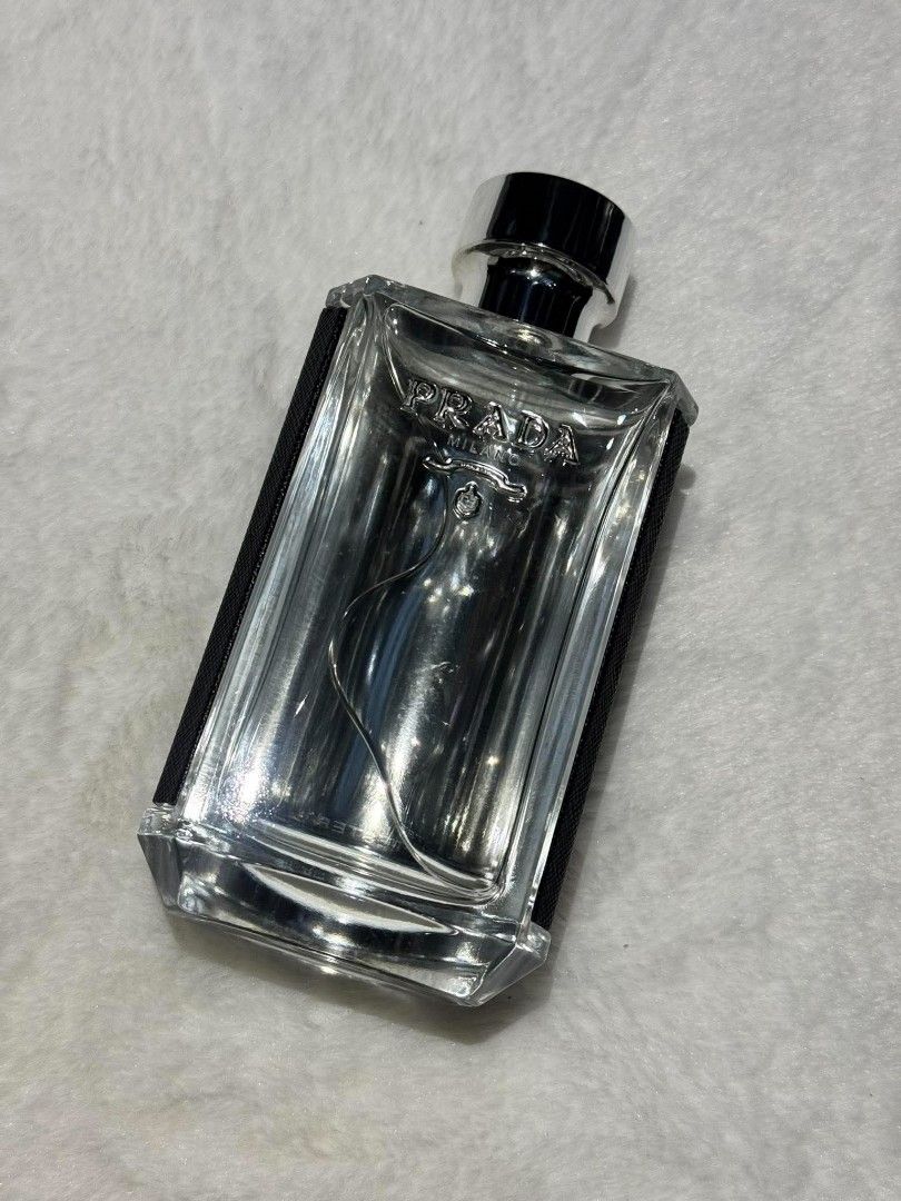 Prada L'Homme Eau De Toilette 100ml (Category: Fragrance & Deodorants) located in Quezon City. Submitted by trade_mnl (Listing ID 1468057690, Image 1). Description: - Authentic Prada L'Homme Eau De Toilette (100ml size) - Full bottle, brand new and ready to use - Features a clear glass front and stylish black Saffiano leather wrap - Complete with silver metal cap and atomizer - Batch code: SG91630 (printed on the bottom base) - Legit demonstratio