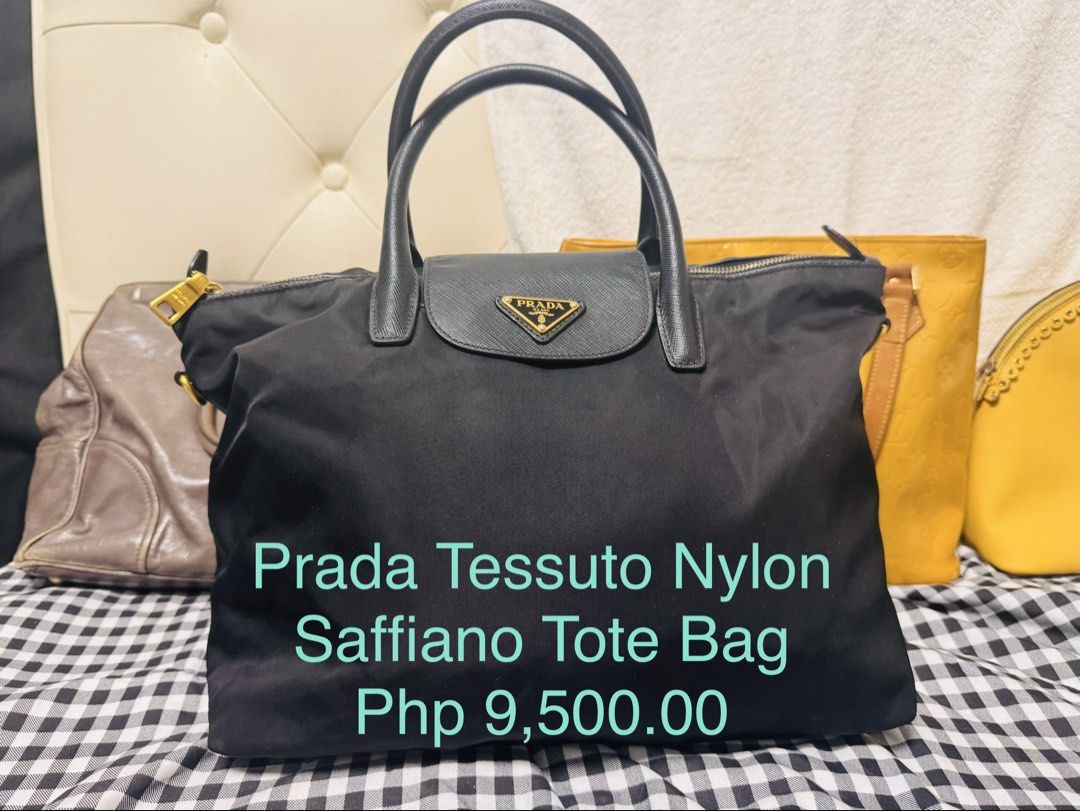 Prada Tessuto Nylon Saffiano Tote Bag (Category: Luxury Bags & Wallets) located in Cagayan de Oro. Submitted by missyfairy789 (Listing ID 1468037632, Image 1). Description: - Authentic Prada Tote Bag - Material: Durable black nylon and Saffiano leather trim - Design: Double top handles with iconic front triangular logo plaque - Interior: Roomy and practical for daily essentials - Closure: Secure zip closure - Versatility: Perfect for daily use, w