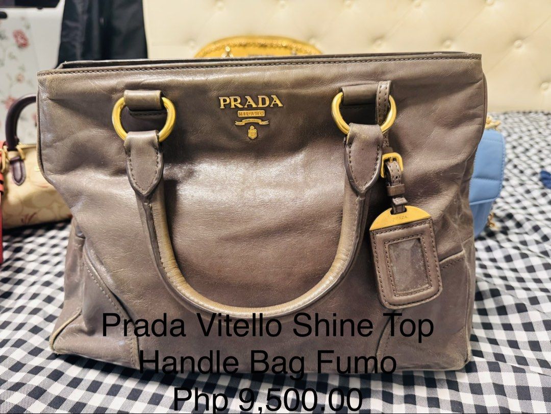 Prada Tessuto Nylon Saffiano Tote Bag (Category: Luxury Bags & Wallets) located in Cagayan de Oro. Submitted by missyfairy789 (Listing ID 1468037632, Image 3). Description: - Authentic Prada Tote Bag - Material: Durable black nylon and Saffiano leather trim - Design: Double top handles with iconic front triangular logo plaque - Interior: Roomy and practical for daily essentials - Closure: Secure zip closure - Versatility: Perfect for daily use, w