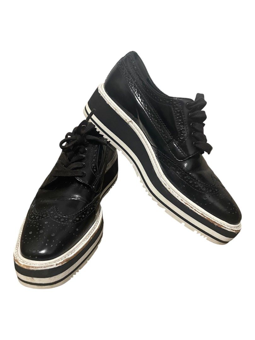 Prada wingtip brouge shoes (Category: Sneakers & Footwear) located in Davao. Submitted by mj_designervintagecurator (Listing ID 1467949461, Image 1). Description: 📌with some paint removed sa sides pls see photos 📌size 35 📌22.5 cm/ 9 inches.