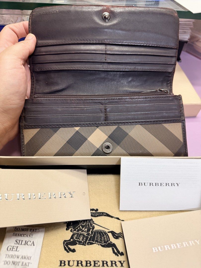 Preloved Burberry Continental Long Wallet (Category: Luxury Bags & Wallets) located in Manila. Submitted by kathsy_16 (Listing ID 1467970226, Image 3). Description: Rfs: decluttering Quality of the wallet is well-used so the imperfections can be seen in pictures (loose thread, scrapped leather, scratches) Thats why I’m selling very low. Authentic Burberry long wallet in classic check canvas - Luxurious brown leather interior with multiple card sl
