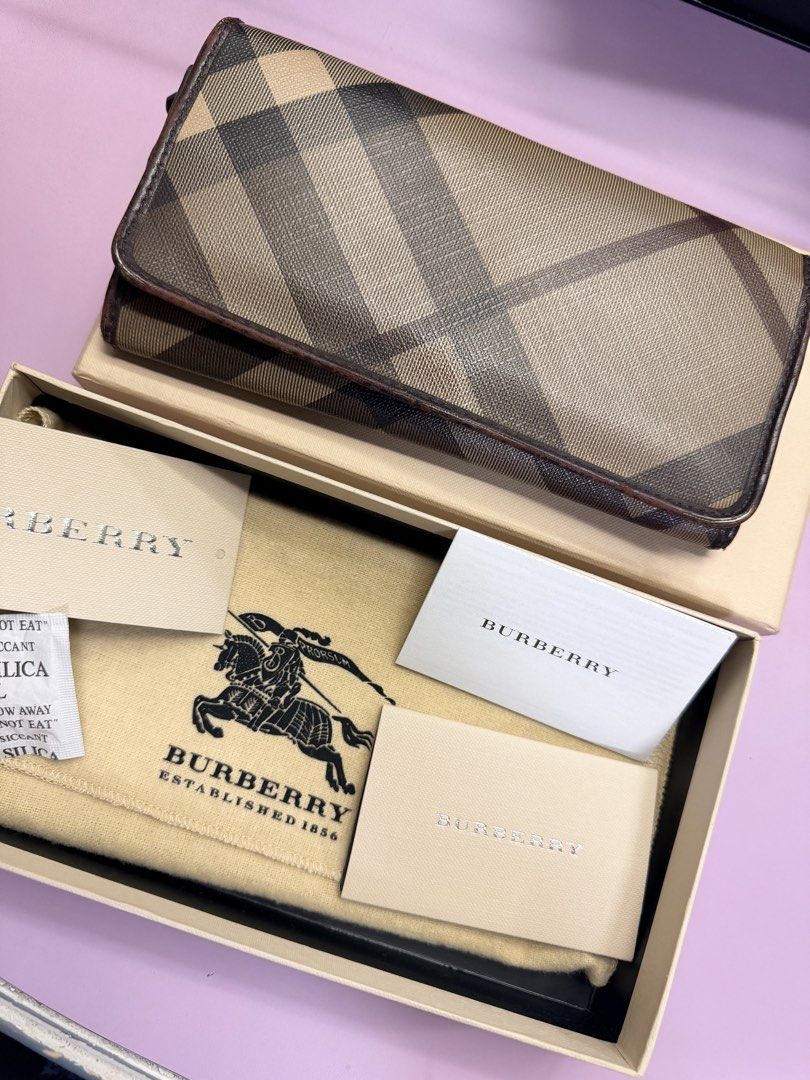 Preloved Burberry Continental Long Wallet (Category: Luxury Bags & Wallets) located in Manila. Submitted by kathsy_16 (Listing ID 1467970226, Image 1). Description: Rfs: decluttering Quality of the wallet is well-used so the imperfections can be seen in pictures (loose thread, scrapped leather, scratches) Thats why I’m selling very low. Authentic Burberry long wallet in classic check canvas - Luxurious brown leather interior with multiple card sl