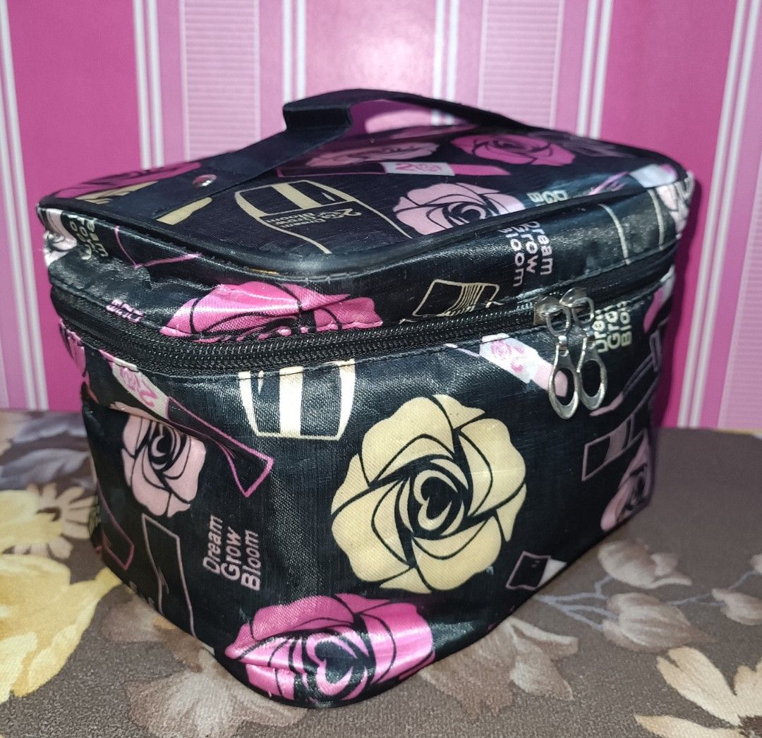 Preloved Makeup Vanity Case Organizer (Category: Purses & Pouches) located in Pasig City. Submitted by bcthriftedzoneonlineshop (Listing ID 1467943983, Image 2). Description: - Cosmetic and toiletry bags - Bag 1: Black background with pink/yellow roses and makeup prints - Bag 2: Brown checkered pattern with a green and red stripe - Features secure zippered main compartments and sturdy top handles - Dark inner lining equipped with practical pocket