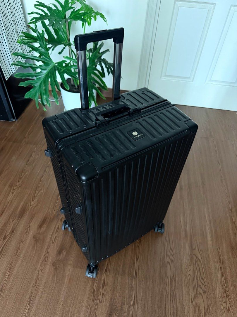 Premium Compass Zipperless XL luggage (Category: Luggage) located in Manila. Submitted by thatgirl0001 (Listing ID 1468053833, Image 3). Description: This luggage was used twice only to film content. Original price: ₱ 14,999 Construction: Hard-shell, zipperless Closure: Aluminum/metal side latches Security: Anti-theft aluminum locking system Wheels: 4-wheel spinner system + wheel protection Handle: Telescoping dual-bar trolley handle Shell: Ribbe