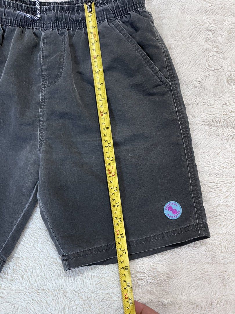 Primark Cares Dark Grey Drawstring Shorts Size 13-14 Yrs (Category: Babies & Kids Fashion) located in Manila. Submitted by kiks_secret_room (Listing ID 1467920396, Image 3). Description: - Brand: Primark Cares - Color: Dark grey - Size: 13-14 years (164cm) - Waist: ~13 inches across (elastic with patterned drawstring) - Length: ~19 inches - Features: Side pockets, cute Tropical Paradise patch near hem, comfortable white mesh lining - Condition: G