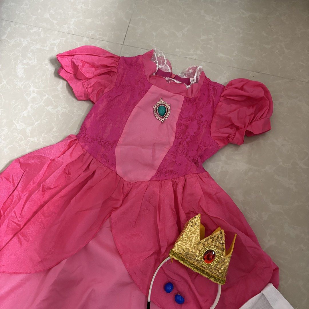Princess Peach Dress (Category: Babies & Kids Fashion) located in Makati City. Submitted by dianedelro (Listing ID 1467946489, Image 3). Description: Pre-loved Princess Peach Dress 👑 Worn only once for Halloween! Set for only ₱500 Includes earrings, crown & gloves .