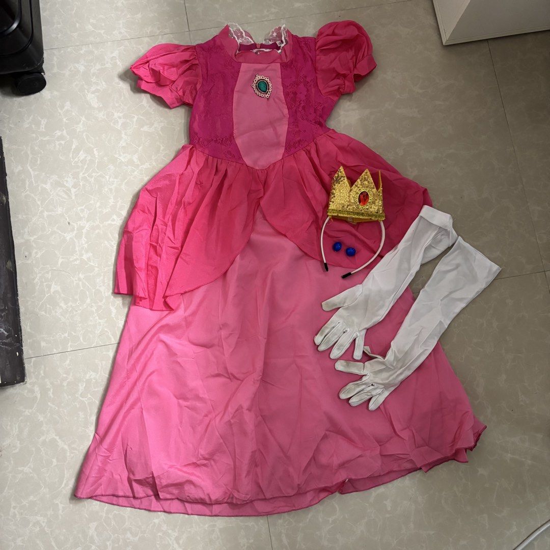 Princess Peach Dress (Category: Babies & Kids Fashion) located in Makati City. Submitted by dianedelro (Listing ID 1467946489, Image 1). Description: Pre-loved Princess Peach Dress 👑 Worn only once for Halloween! Set for only ₱500 Includes earrings, crown & gloves .