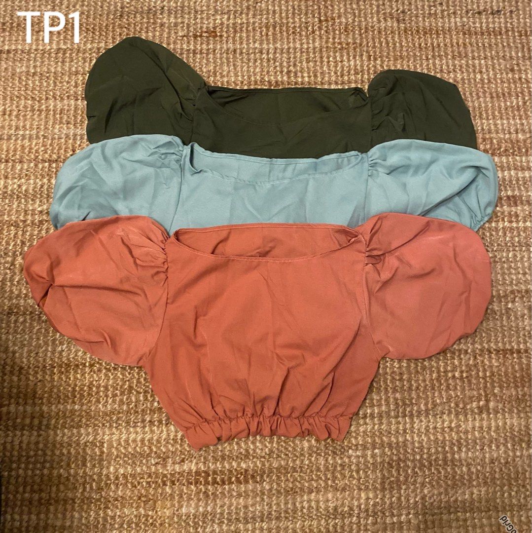Puff Sleeve Crop Top Bundle Set of 3 (Category: Shirts) located in Caloocan City. Submitted by yzaaaaaviles (Listing ID 1467875937, Image 1). Description: Puff Sleeve Crop Top Bundle Set of 3 in Size S-M Includes dark green, light blue, and terracotta pink. Features a square neckline, oversized puff sleeves, and elastic hem. Lightweight and breathable fabric. Selling as a set..