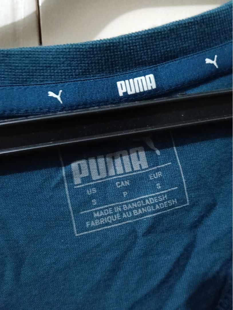 Puma Blue Graphic T-Shirt Size S (Category: Shirts) located in Manila. Submitted by goddesssy (Listing ID 1467839940, Image 2). Description: - Brand: Puma - Color: Teal blue with large white stacked logo - Size: S (US, CAN, EUR) - Material: Comfortable cotton (Made in Bangladesh) - Style: Crew neck, short sleeves - Condition: Great for casual wear or workouts - Fast shipping and reliable seller!.