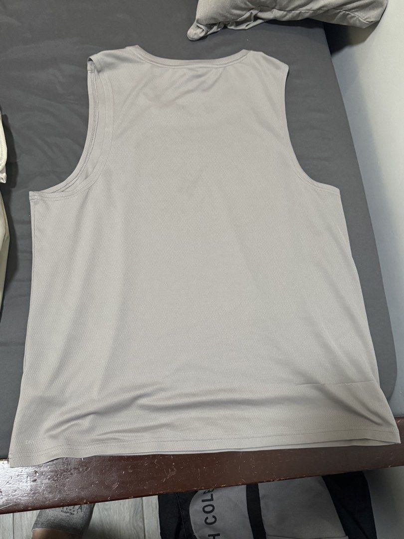 Puma Men's Grey Athletic Tank Top Size M (Category: Activewear) located in Imus. Submitted by jaimeenrico8 (Listing ID 1467873173, Image 3). Description: - Brand: Puma - Type: Sleeveless gym top / tank - Size: Medium (Standard fit) - Color: Grey with silver Puma cat logo - Material: Breathable mesh fabric - Condition: Clean, no tears, no stains.