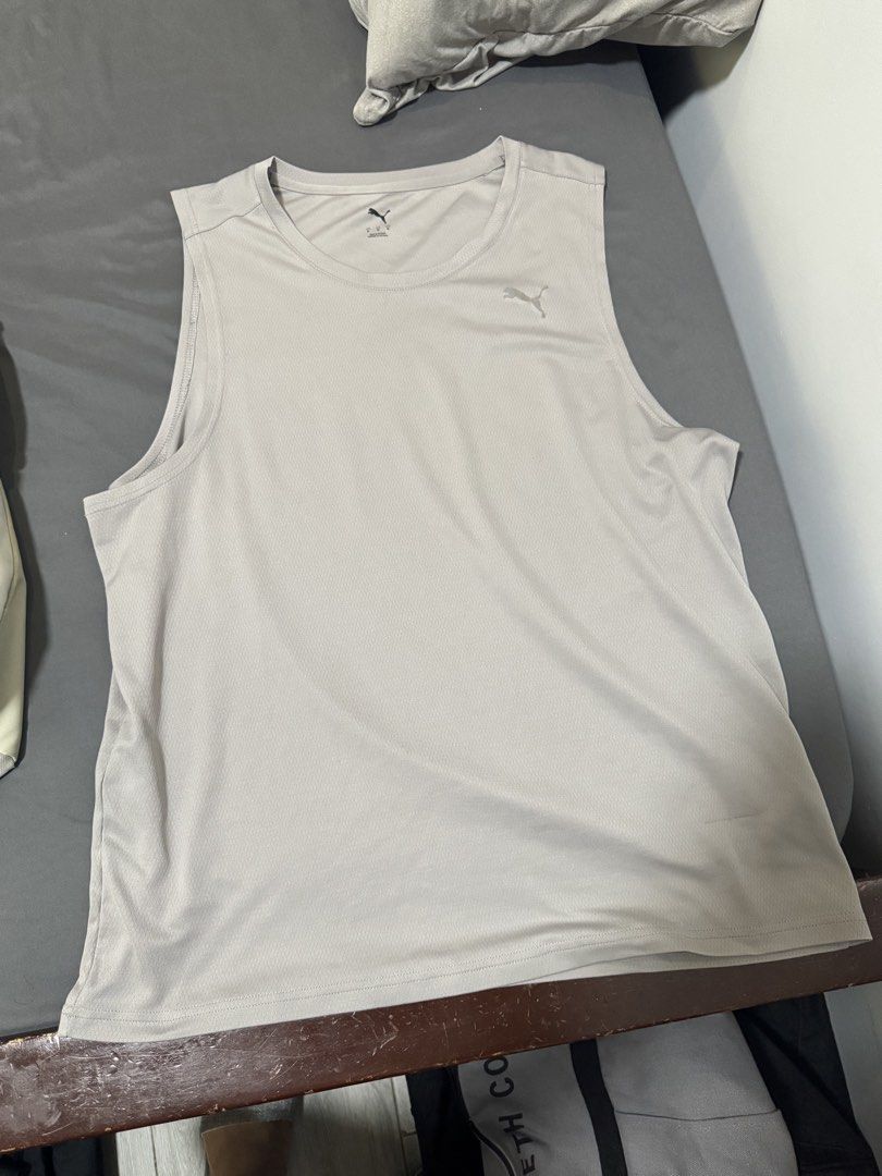 Puma Men's Grey Athletic Tank Top Size M (Category: Activewear) located in Imus. Submitted by jaimeenrico8 (Listing ID 1467873173, Image 1). Description: - Brand: Puma - Type: Sleeveless gym top / tank - Size: Medium (Standard fit) - Color: Grey with silver Puma cat logo - Material: Breathable mesh fabric - Condition: Clean, no tears, no stains.