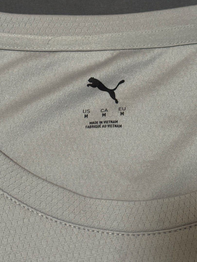 Puma Men's Grey Athletic Tank Top Size M (Category: Activewear) located in Imus. Submitted by jaimeenrico8 (Listing ID 1467873173, Image 2). Description: - Brand: Puma - Type: Sleeveless gym top / tank - Size: Medium (Standard fit) - Color: Grey with silver Puma cat logo - Material: Breathable mesh fabric - Condition: Clean, no tears, no stains.