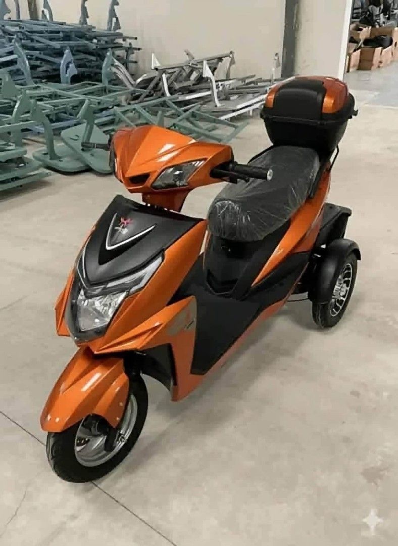 Purple Three Wheel Electric Mobility Scooter With Storage Box (Category: Skates, Rollerblades & Scooters) located in Manila. Submitted by idealtoys (Listing ID 1467886854, Image 2). Description: - Condition: Brand new and totally unused (plastic wrapping still on the seat) - Color: Purple - Design: 3-wheel setup (2 rear wheels for extra stability) with a flat footboard for easy mounting - Storage: Includes a matching lockable storage box on the b