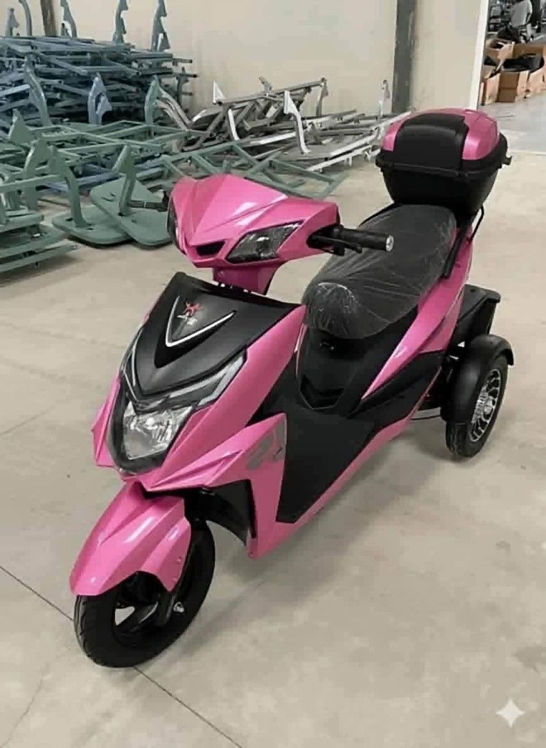 Purple Three Wheel Electric Mobility Scooter With Storage Box (Category: Skates, Rollerblades & Scooters) located in Manila. Submitted by idealtoys (Listing ID 1467886854, Image 3). Description: - Condition: Brand new and totally unused (plastic wrapping still on the seat) - Color: Purple - Design: 3-wheel setup (2 rear wheels for extra stability) with a flat footboard for easy mounting - Storage: Includes a matching lockable storage box on the b