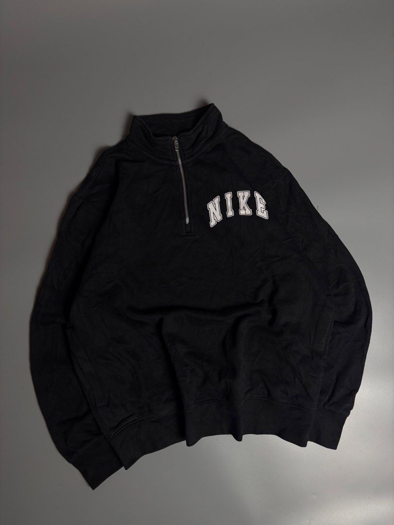 QZIP NIKE (Category: Coats, Jackets and Outerwear) located in Manila. Submitted by livefalcon-c64e (Listing ID 1467944294, Image 1). Description: - Brand: Nike - Style: Black half-zip sweatshirt with mock neck and metallic zipper - Size: Large - Details: Collegiate arched Nike lettering embroidered on chest, small swoosh on back neck - Interior: Soft fleece lining - Condition: Clean fabric with standard ribbed cuffs and hem - Style Code: FZ0874-0