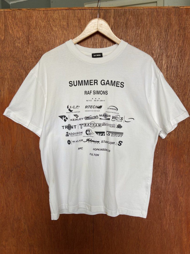 Raf Simon Summer Games Tee (Category: Tshirts & Polo Shirts ) located in Panabo. Submitted by thrifty.red (Listing ID 1467887274, Image 1). Description: width:22 length:28 need wash washable yellow.