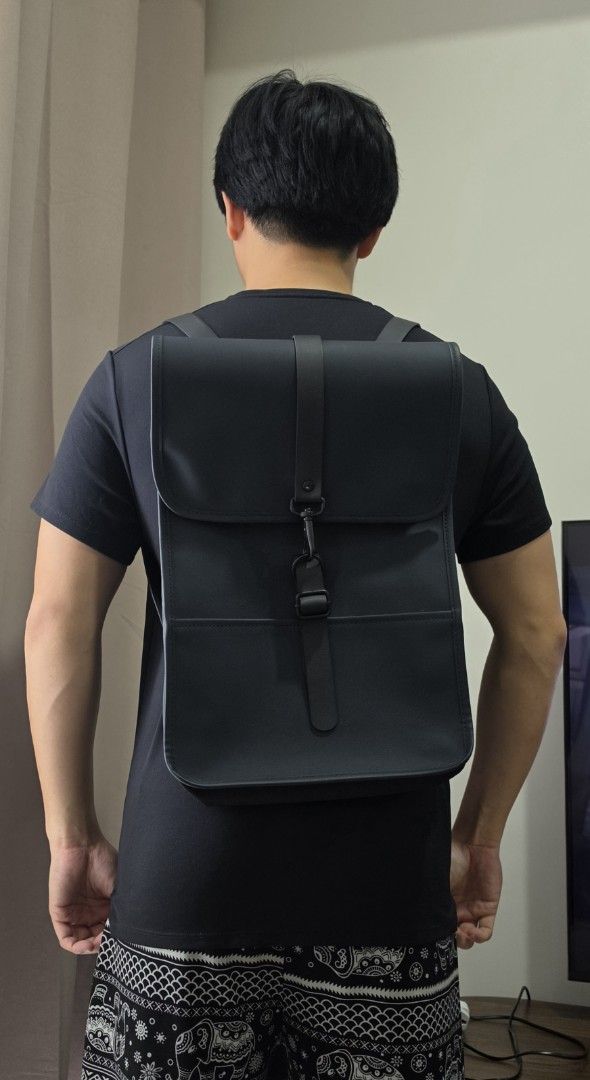 Rains Backpack (Category: Backpacks) located in Quezon City. Submitted by jjamestan (Listing ID 1467889100, Image 3). Description: Selling my RAINS backpack in navy blue / dark blue. Features: • Water-resistant material • Minimalist Scandinavian design • Signature front flap with carabiner closure • Adjustable shoulder straps • Spacious main compartment • Interior zip pocket Perfect for everyday use, work, commuting, and travel. Sleek, functional
