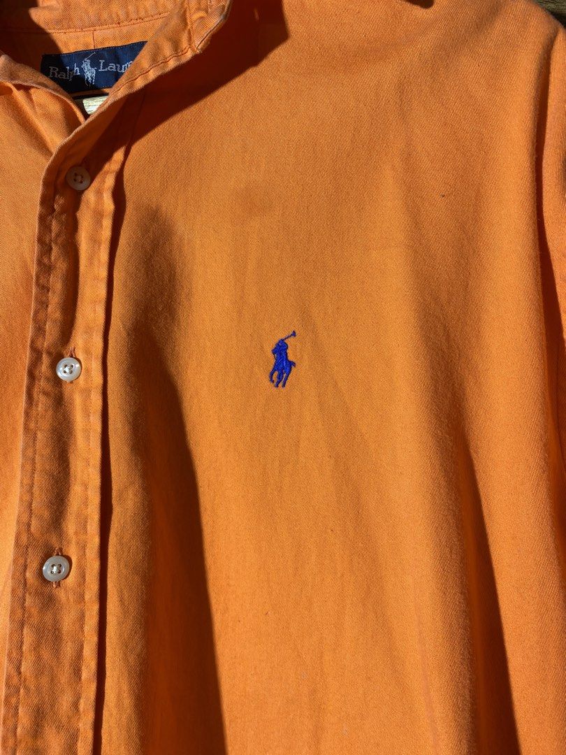 Ralph Lauren Button-Down Shirt (Category: Tshirts & Polo Shirts ) located in Caloocan City. Submitted by rhouzze.ph (Listing ID 1467967079, Image 2). Description: Name: Ralph Lauren Polo Dimensions: 26 by 34 Size: XL Condition: Fair Condition Issue: Faded dots and small stains.