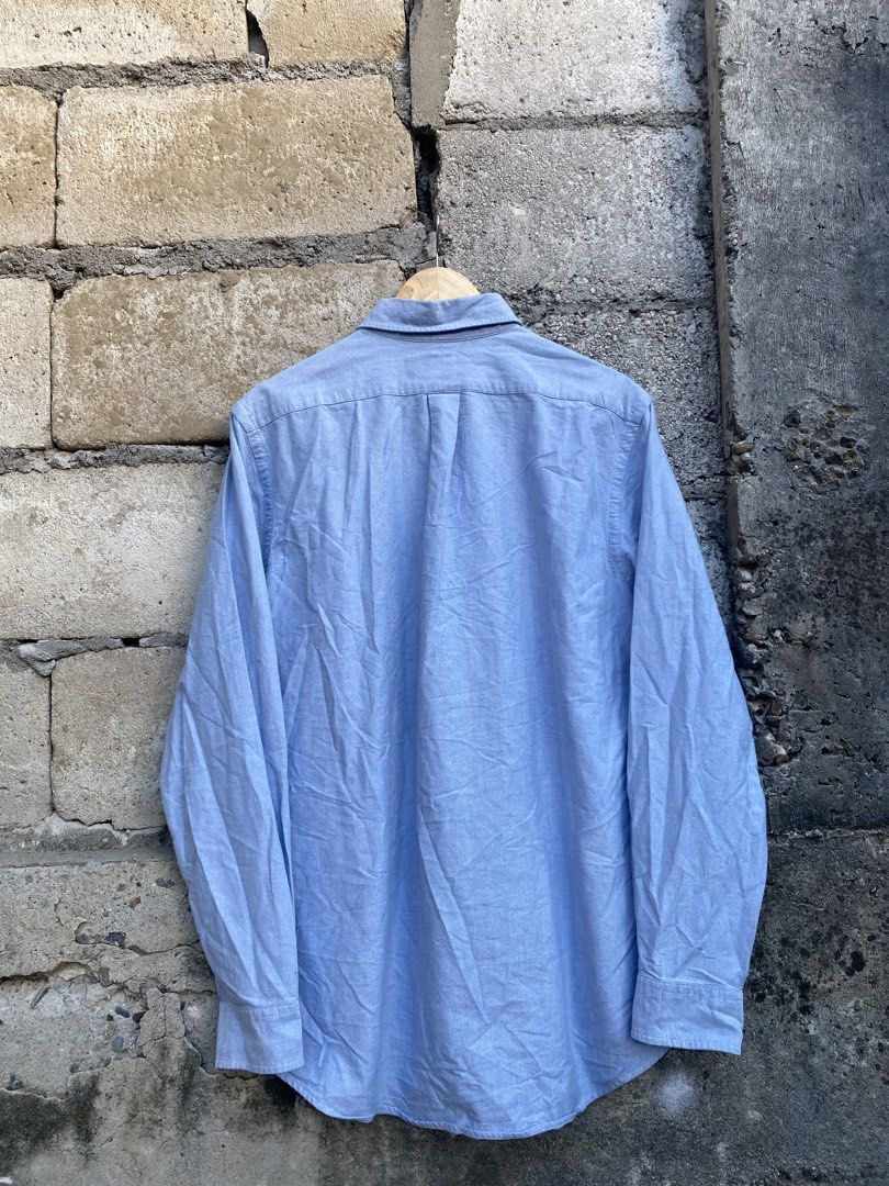 Ralph Lauren Polo Bear Button Down (Category: Activewear) located in Candaba. Submitted by dejesus.bench17 (Listing ID 1468008092, Image 2). Description: Polo Ralph Lauren Polo Bear Button Down -Color: Sky blue -Condition: Excellent -Color rate: 9/10 -Issue: See last pic -Dimes: W22 L29 -Price: 999 + ship.