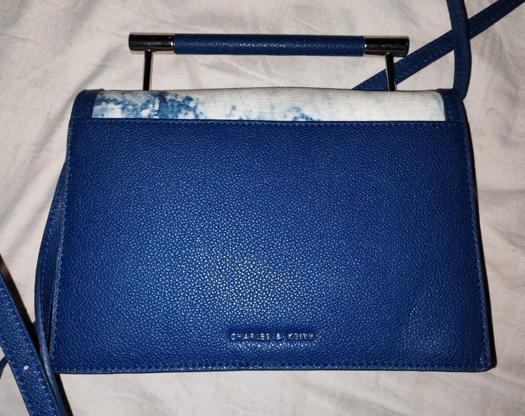 Rare Charles And Keith Marble Design Bag (Category: Cross-body Bags) located in Cagdianao. Submitted by lavendear.clotheshoppe (Listing ID 1467863628, Image 2). Description: Super unique, marble design Charles And Keith Crossbody bag Very eye catching, collector's piece! We ship nationwide via tiktok Check out.