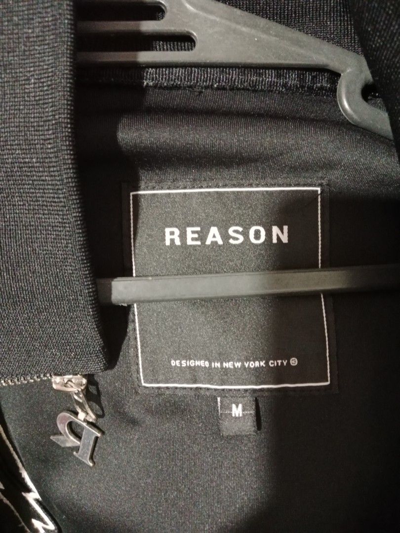 Reason Brand NYC Take Whats Yours Jacket (Category: Coats, Jackets and Outerwear) located in Manila. Submitted by 2broke2diern (Listing ID 1467847078, Image 3). Description: - Brand: Reason (New York City) - Style: Black zip-up streetwear jacket - Size: Medium (M) - Back Details: Large panther graphic with 'TAKE WHATS YOURS' text, framed by lightning bolts and roses and a Panther - Front Details: Embroidered skeleton hand and grim reaper patches 