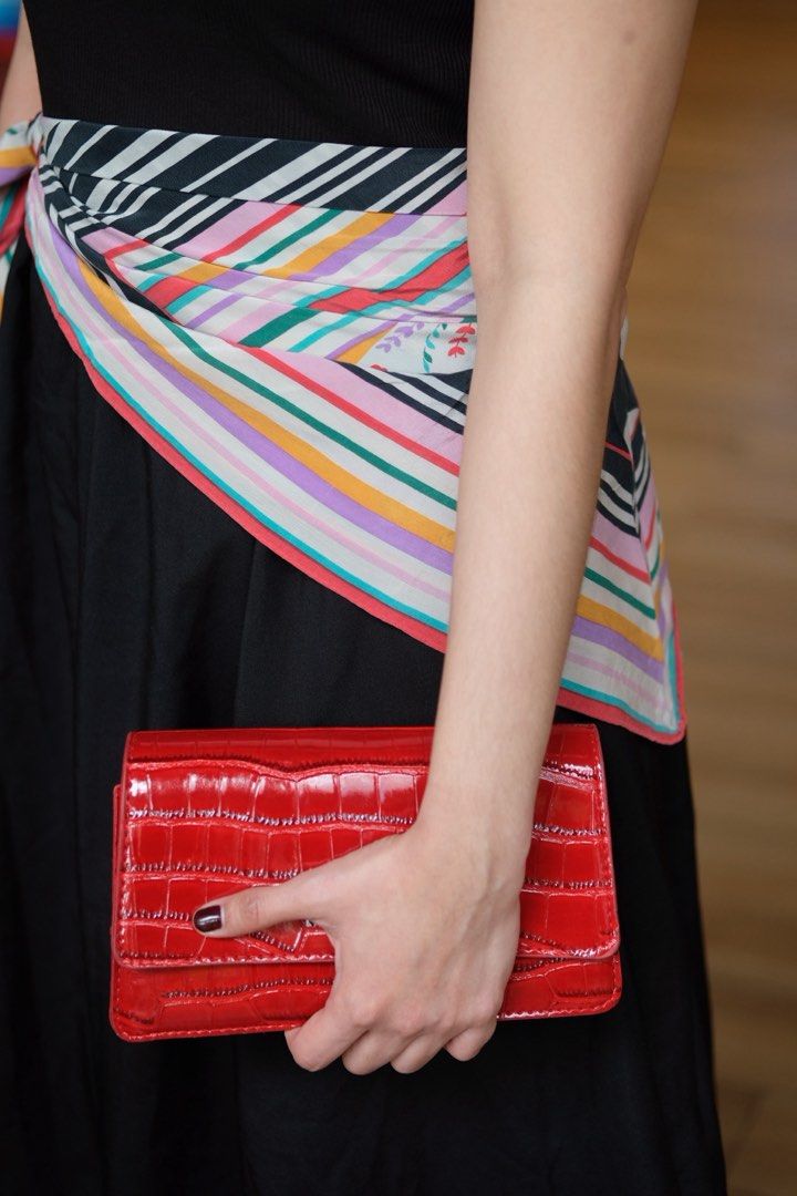 red bag (Category: Luxury Bags & Wallets) located in Caloocan City. Submitted by shopmyclosetttttt (Listing ID 1467952585, Image 1). Description: - Color: Bright red - Material: Glossy croc texture with patent finish - Design: Structured rectangular shape with flap closure - Strap: Versatile thick gold chain (can be worn long or doubled up) - Interior: Clean lining - Condition: Excellent - Perfect statement piece to elevate any outfit.