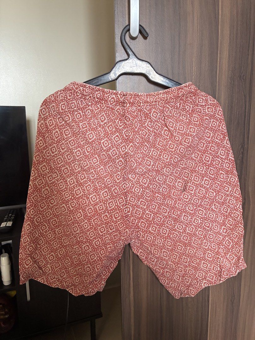 Red patterned elastic waist shorts (Category: Shorts) located in Las Pinas. Submitted by mrcolorless (Listing ID 1467913675, Image 2). Description: - Vibrant red shorts with an all-over geometric pattern - Comfortable elastic waistband with a relaxed fit - Lightweight fabric, perfect for hot weather - Easy pull-on style for everyday casual wear.