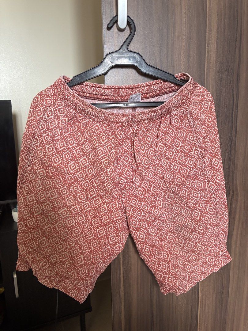 Red patterned elastic waist shorts (Category: Shorts) located in Las Pinas. Submitted by mrcolorless (Listing ID 1467913675, Image 1). Description: - Vibrant red shorts with an all-over geometric pattern - Comfortable elastic waistband with a relaxed fit - Lightweight fabric, perfect for hot weather - Easy pull-on style for everyday casual wear.