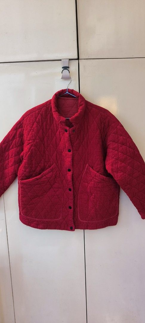Red Quilted Jacket Puffer Coat with Front Pockets (Category: Coats, Jackets and Outerwear) located in Paranaque City. Submitted by lizpretty05 (Listing ID 1467842419, Image 1). Description: Bright red quilted jacket with diamond stitching pattern. High mock neckline and snap button closure down the front. Two large patch pockets on the lower front. Quilted fabric inside and out. Relaxed boxy fit through the body. Inside tag attached near the bott
