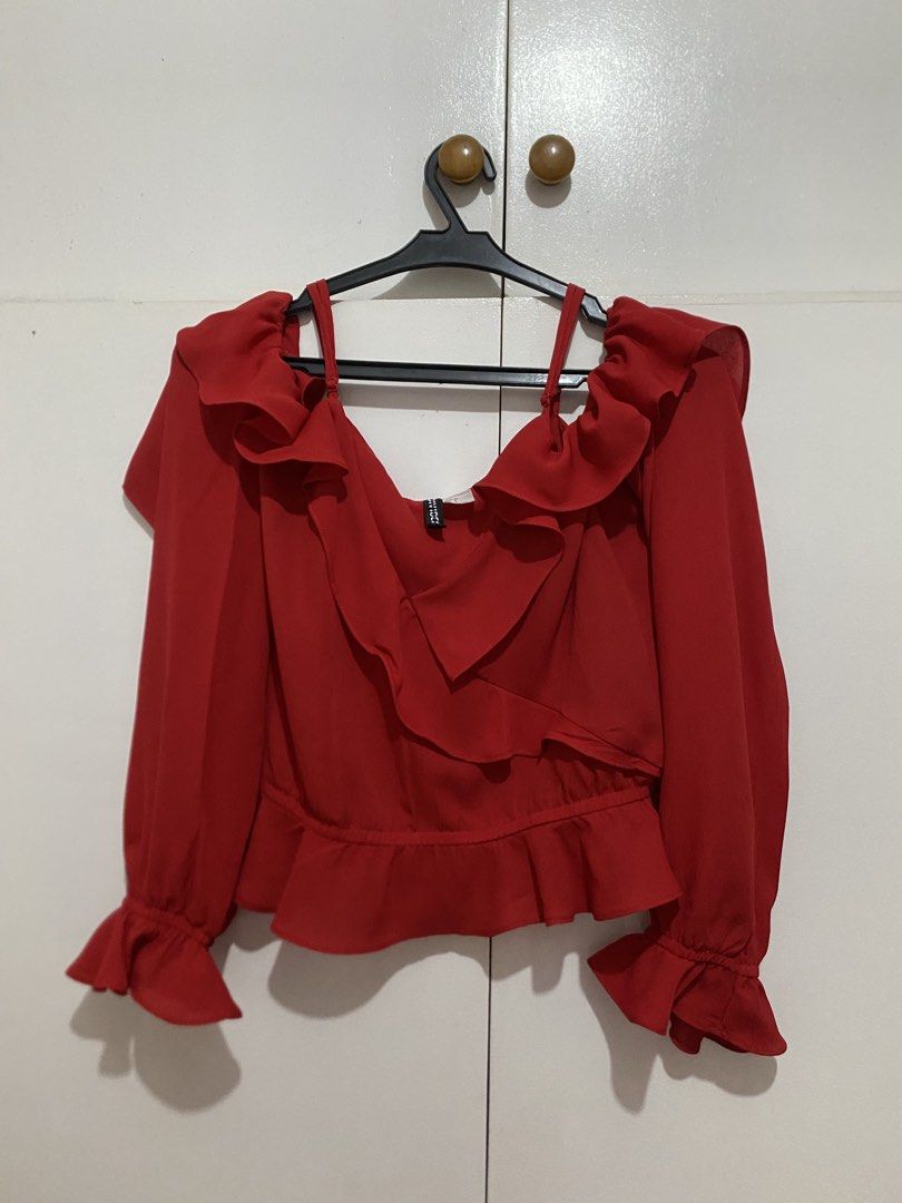 Red Ruffle Long Sleeve Off-Shoulder Blouse (Category: Blouses) located in Quezon City. Submitted by addy_addy (Listing ID 1468007164, Image 1). Description: - Color: Vibrant red - Design: Statement ruffles on neckline, shoulders, hem, and cuffs with thin supportive straps - Adjustable straps!! - Fabric: Sheer, lightweight and comfortable.