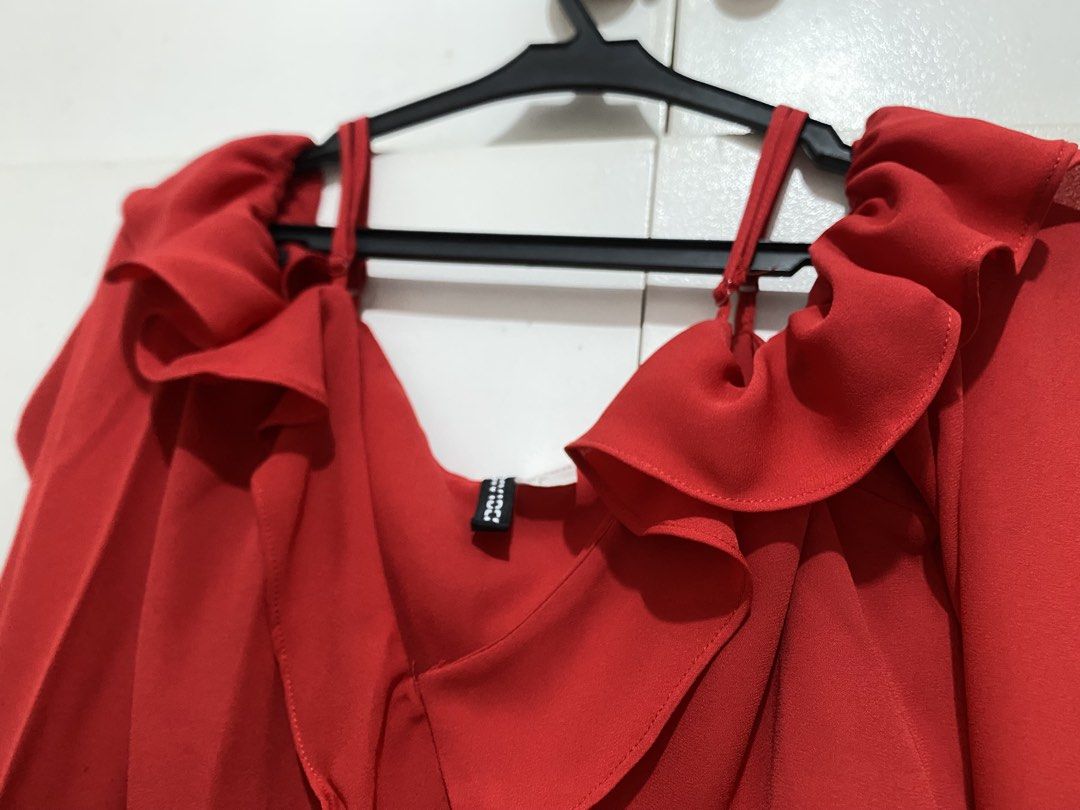 Red Ruffle Long Sleeve Off-Shoulder Blouse (Category: Blouses) located in Quezon City. Submitted by addy_addy (Listing ID 1468007164, Image 3). Description: - Color: Vibrant red - Design: Statement ruffles on neckline, shoulders, hem, and cuffs with thin supportive straps - Adjustable straps!! - Fabric: Sheer, lightweight and comfortable.