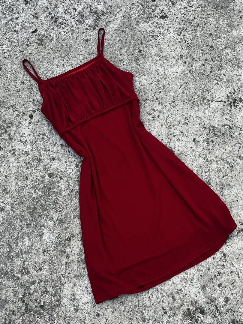 Red Spaghetti Strap Ruched Mini Dress (Category: Dresses) located in San Fernando. Submitted by angelhave_wings (Listing ID 1468058774, Image 2). Description: - Color: Deep red - Style: Mini dress with spaghetti straps and slip-on fit - Details: Chic ruched overlay across the chest - Material: Smooth, comfortable fabric - Versatility: Easy to dress up for nights out or down for casual daytime looks.