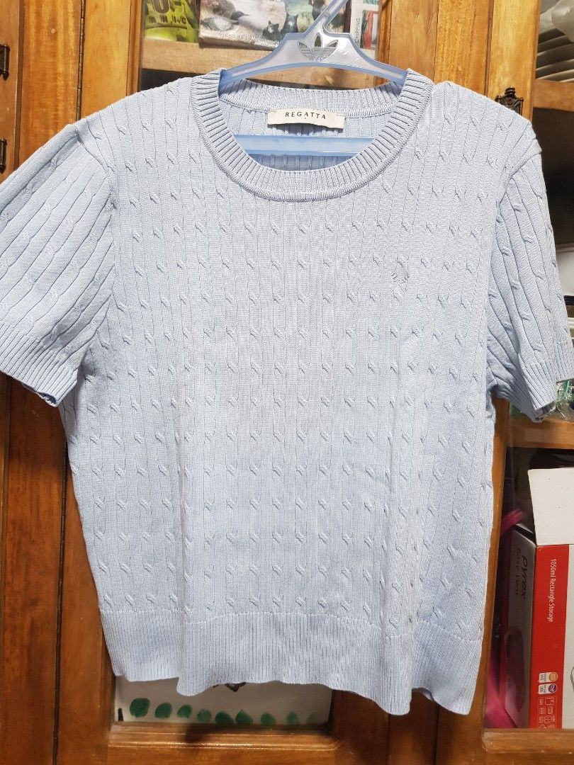 Regatta Light Blue Cable Knit Shirt (Category: Blouses) located in Baguio. Submitted by soonshimcart (Listing ID 1467853956, Image 1). Description: - Brand: Regatta - Color: Light Blue - Size: Large - Pattern: Classic cable knit - Details: Round neckline with ribbed collar and cuffs - Fabric: Soft and comfortable - Condition: Great basic piece for layering or standalone wear.