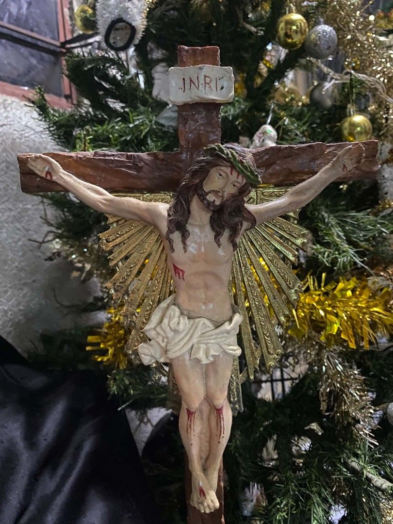 Religious Crucifix Statue Figurine with Stand (Category: Religious Items) located in Caloocan City. Submitted by aragonbene76165 (Listing ID 1468056358, Image 1). Description: - Detailed standing crucifix featuring Jesus and the INRI plaque - Wooden-textured cross design with a decorative golden sunburst accent - Hand-painted figurine crafted from durable resin or composite material - Sturdy, ornate base designed for stable tabletop display - Per