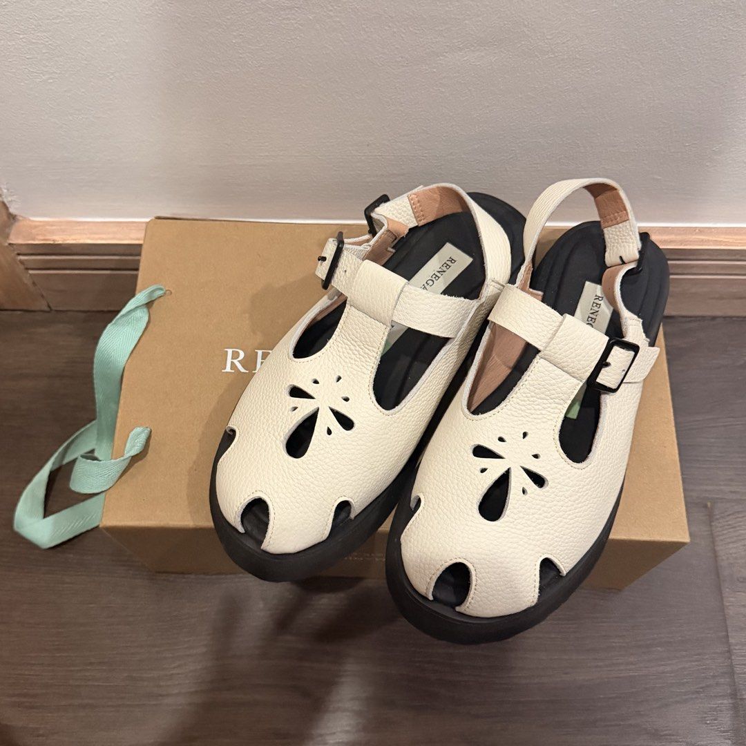 Renegade Folk White Leather Sandals (Category: Flats & Sandals) located in San Pedro. Submitted by love.bruce10 (Listing ID 1467898292, Image 1). Description: - Brand: Renegade Folk - Color: White with textured leather finish - Design: Closed-toe style featuring cute cutout flower patterns and adjustable buckle straps - Sole: Sturdy black lug soles with excellent tread grip - RFS too small - Inclusions: Comes with the original box - Condition: Ex