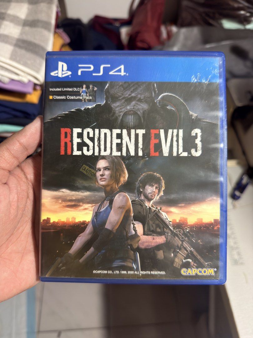 Resident Evil 3 PS4 Game (Category: PlayStation) located in Manila. Submitted by artiku_lo (Listing ID 1467871859, Image 1). Description: - Platform: PlayStation 4 (PS4) - Condition: Clean, includes original case and disc - Inclusions: Classic Costume Pack DLC included - Genre: Action Horror by Capcom - Mode: Single-player campaign.