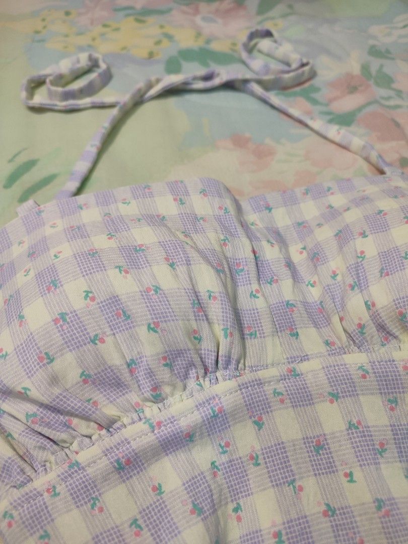 reworked Lilac Gingham Floral Halter Padded Top (Category: Sleeveless) located in Jaen. Submitted by roxantiago (Listing ID 1468037091, Image 3). Description: - Style: Cottagecore halter top - Pattern: Lilac and pale yellow gingham with all-over tiny floral prints - Details: Adjustable neck ties, cute back ribbon, and ruched bust with soft shaping - Fit: Fitted waist, hits right at the hips - Condition: Worn once, still in great shape S to M.