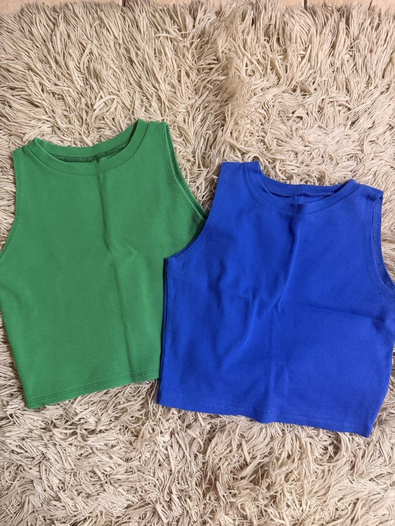 Ribbed Crop Tank Tops (Category: Sleeveless) located in Manila. Submitted by theaxxxx (Listing ID 1467889948, Image 1). Description: - Set of 2 ribbed crop tank tops (Bright Green & Royal Blue) - Sleeveless design with a classic round neckline - Soft and stretchy fabric for an easy, comfortable fit - Versatile style, looks great with high-waisted jeans or shorts - Selling as a bundle only - PM for inquiries or fast checkout!.