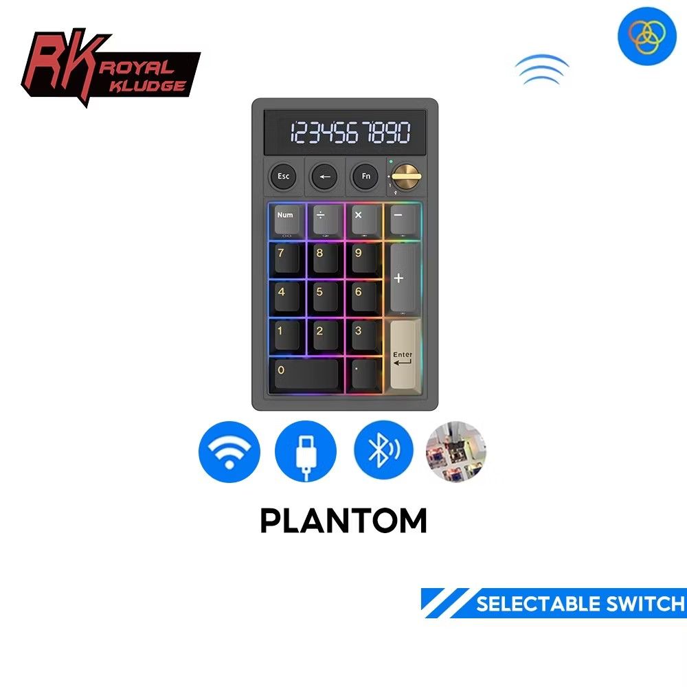 RK Royal Kludge Plantom Numeric Keypad Calculator in Cream Switch (Category: Computer Keyboard) located in Manila. Submitted by engr.ela (Listing ID 1467926085, Image 2). Description: - 2-in-1 Design: Combines a mechanical numeric keypad and a functional calculator with a built-in display screen. - Aesthetic Build: Stylish dark grey chassis, black keycaps, and a premium gold volume knob with clear RGB backlighting. - Tri-Mode Connectivity: Connec