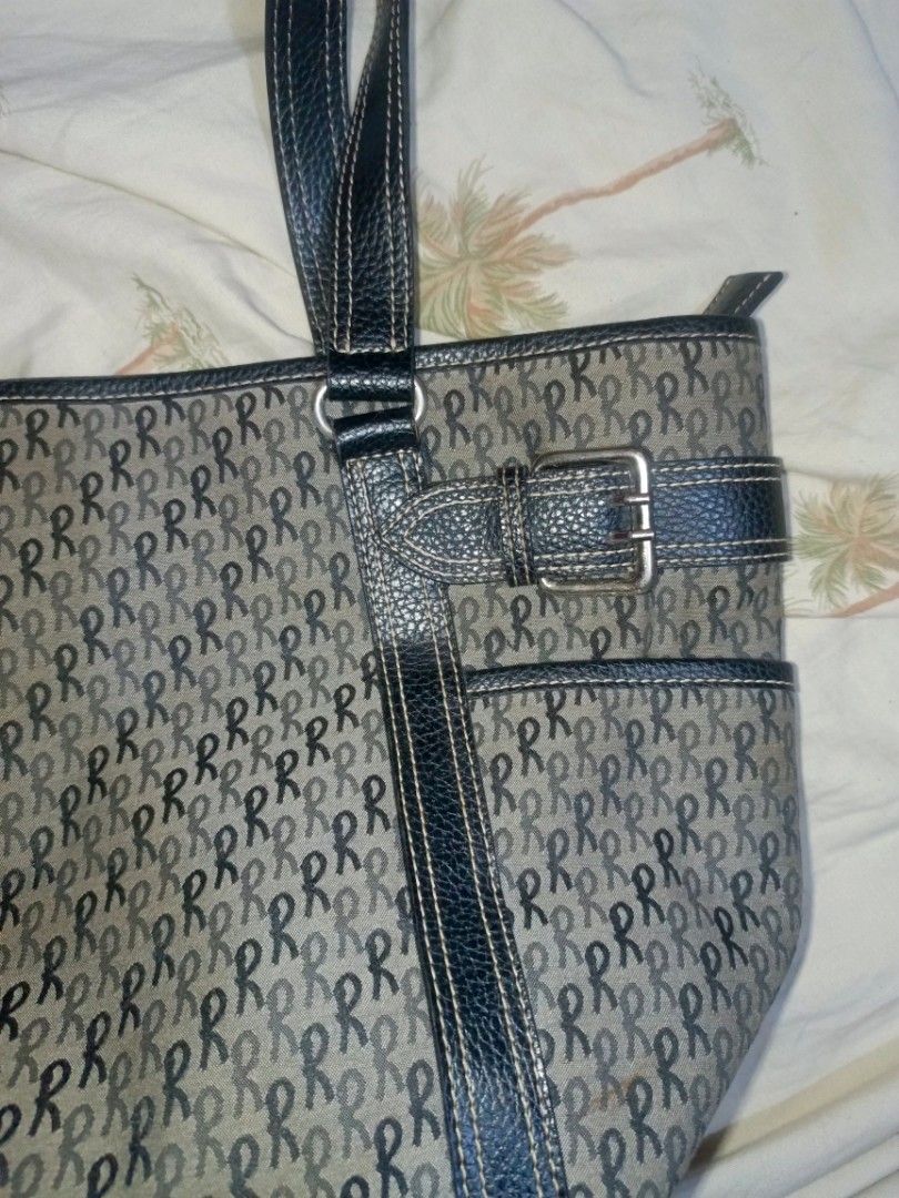 Roberta di Camerino Tote Bag Monogram Print (Category: Luxury Bags & Wallets) located in Pililla. Submitted by stephenivan (Listing ID 1468056047, Image 3). Description: Roberta di Camerino tote bag in a grey and black monogram pattern. Black textured straps and trim with decorative buckle accents on the sides. Top zip closure with black fabric lining inside. Includes internal zippered pockets for organization. Spacious design with sturdy handles