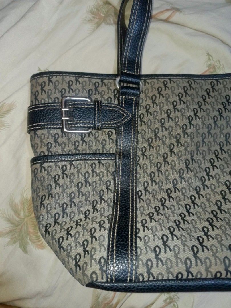 Roberta di Camerino Tote Bag Monogram Print (Category: Luxury Bags & Wallets) located in Pililla. Submitted by stephenivan (Listing ID 1468056047, Image 2). Description: Roberta di Camerino tote bag in a grey and black monogram pattern. Black textured straps and trim with decorative buckle accents on the sides. Top zip closure with black fabric lining inside. Includes internal zippered pockets for organization. Spacious design with sturdy handles