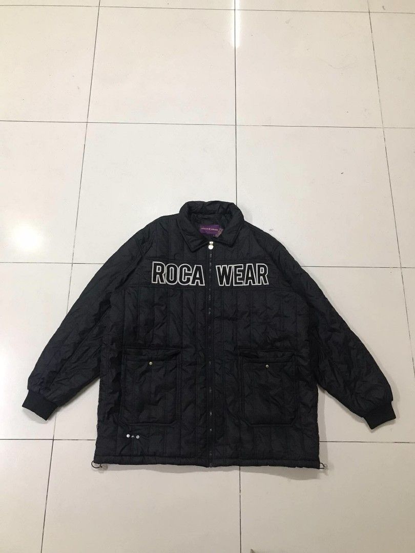 Roca Wear Quilted Black Puffer Jacket 3XL (Category: Coats, Jackets and Outerwear) located in Manila. Submitted by youngstorm-c604 (Listing ID 1467895543, Image 1). Description: - Brand: Roca Wear - Style: Black quilted puffer jacket with relaxed oversized fit - Details: Bold white lettering across the chest - Closure: Zip-up front - Pockets: Functional pockets with snap buttons - Fit: Adjustable drawcord hem for a custom fit - Interior: Purple n