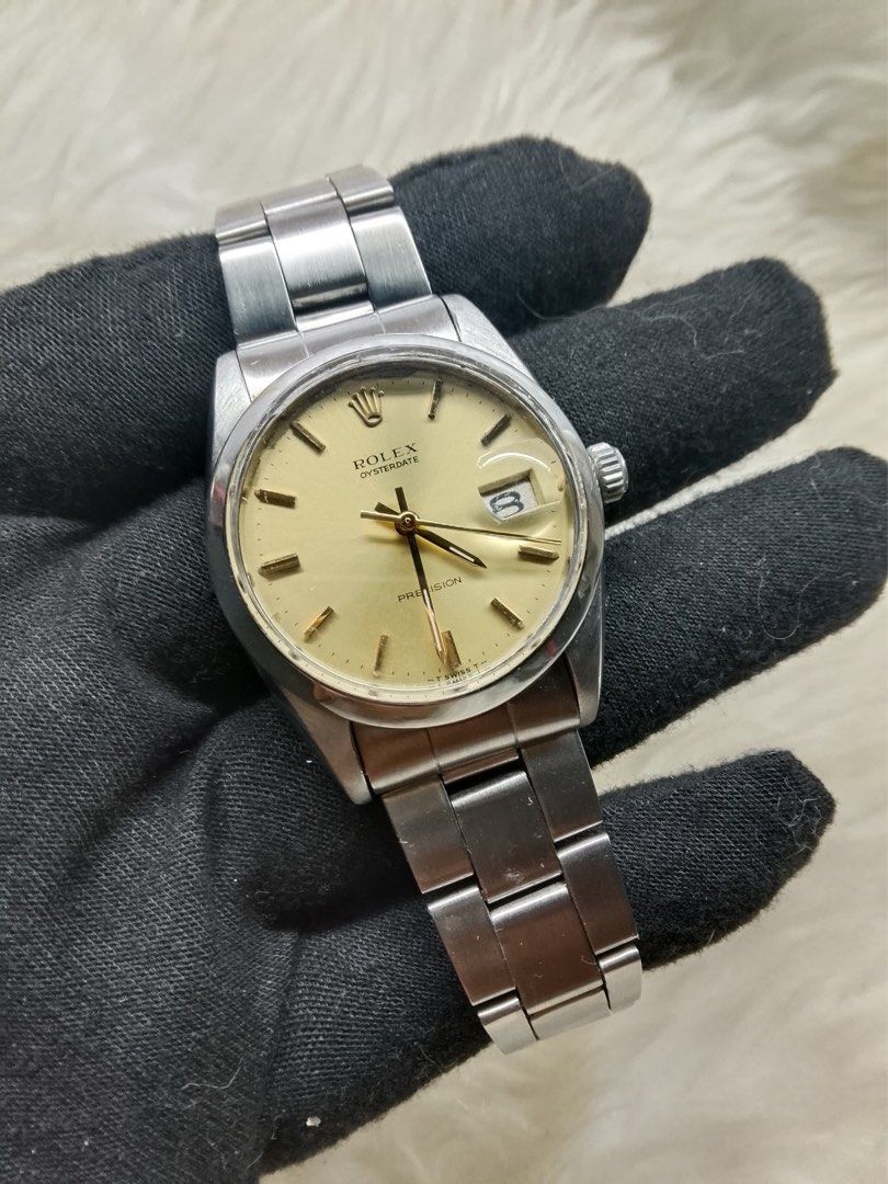 Rolex Oysterdate Precision 6694 (Serviced) (Category: Luxury Watches) located in Pasig City. Submitted by tommychonk (Listing ID 1467594234, Image 2). Description: - Newly serviced -Oct 14, 2026 - Brand/Model: Rolex Oysterdate Precision -Ref 6694; 34mm - Movement: Manual wind - Dial: Champagne sunburst with gold markers and hands - Bracelet: All original - Features: Date window with cyclops lens, signed crown, signed deployment clasp with coronet