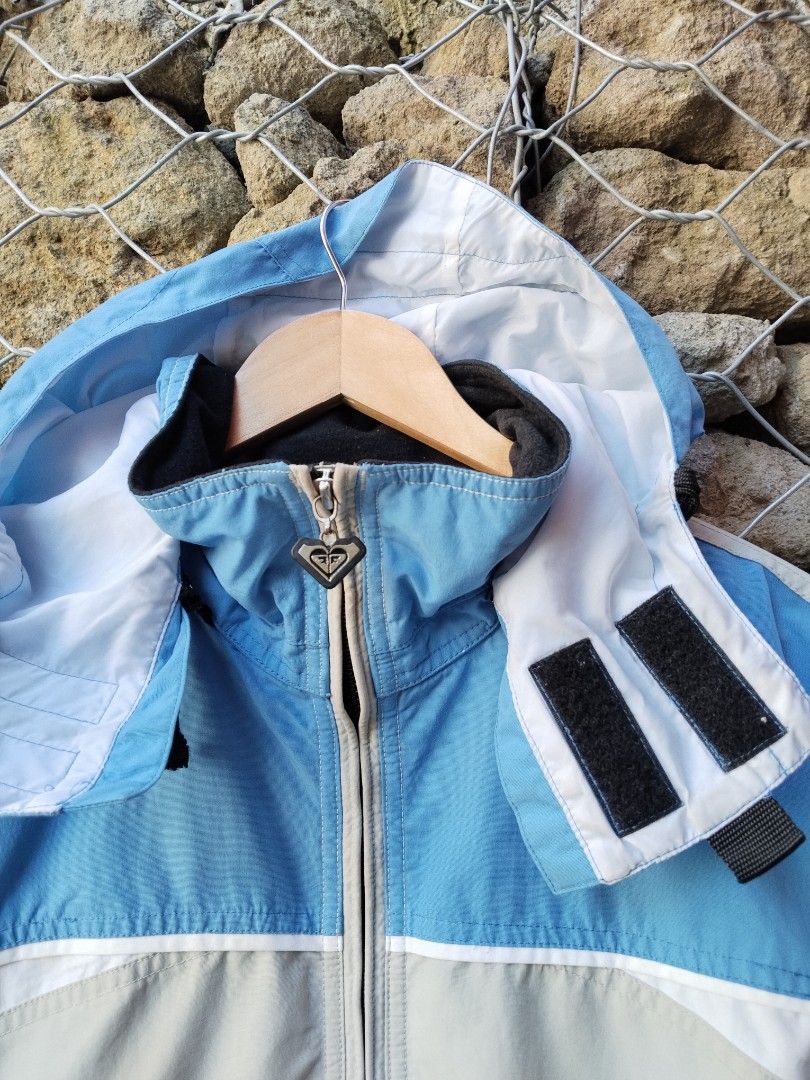 Roxy Quiksilver Snowboardwear Jacket Blue Grey Medium (Category: Coats, Jackets and Outerwear) located in Manila. Submitted by carlmichae22397 (Listing ID 1467903291, Image 3). Description: - Brand: Roxy Quiksilver - Type: Boardwear / Winter Jacket - Color: Blue and light grey - Size: Medium - Material: Nylon shell with polyester lining - Closure: Full zip with custom heart zipper pull - Hood: Attached with drawstrings and velcro neck closure - P