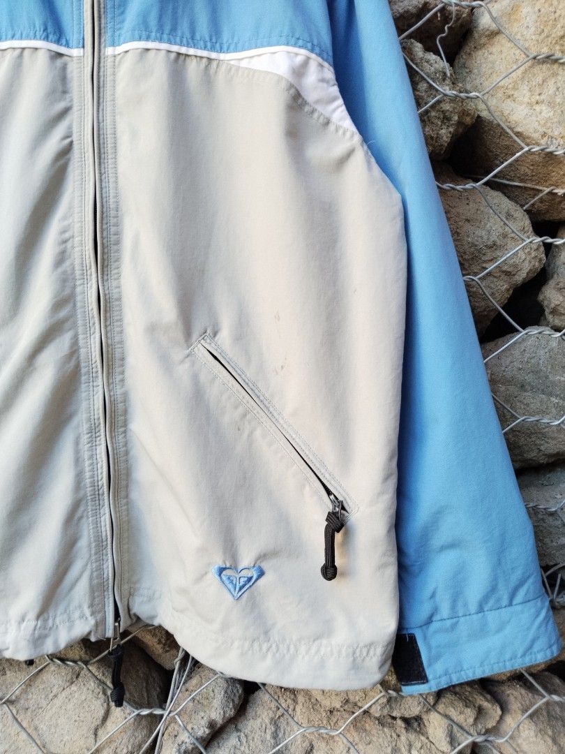 Roxy Quiksilver Snowboardwear Jacket Blue Grey Medium (Category: Coats, Jackets and Outerwear) located in Manila. Submitted by carlmichae22397 (Listing ID 1467903291, Image 2). Description: - Brand: Roxy Quiksilver - Type: Boardwear / Winter Jacket - Color: Blue and light grey - Size: Medium - Material: Nylon shell with polyester lining - Closure: Full zip with custom heart zipper pull - Hood: Attached with drawstrings and velcro neck closure - P