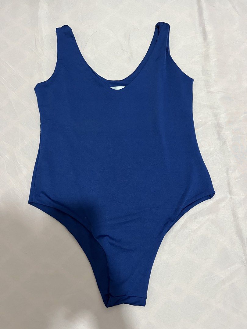 Royal Blue Sleeveless Bodysuit (Category: Others Tops) located in Tanza. Submitted by vhies_closet24 (Listing ID 1467885856, Image 1). Description: Details: • Color: Royal Blue • Style: Sleeveless, scoop-neck bodysuit • Fit: Stretchy and body-hugging • Perfect for casual wear, parties, or layering with jeans and skirts • Condition: Please see actual photos .
