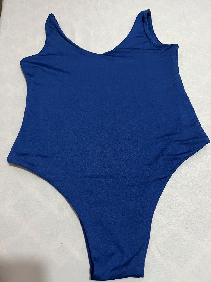 Royal Blue Sleeveless Bodysuit (Category: Others Tops) located in Tanza. Submitted by vhies_closet24 (Listing ID 1467885856, Image 3). Description: Details: • Color: Royal Blue • Style: Sleeveless, scoop-neck bodysuit • Fit: Stretchy and body-hugging • Perfect for casual wear, parties, or layering with jeans and skirts • Condition: Please see actual photos .