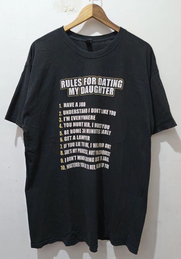 Rules for Dating My Daughter Statement Tee (Category: Tshirts & Polo Shirts ) located in Taguig. Submitted by thriftedminds (Listing ID 1468056482, Image 1). Description: Item: Rules for Dating My Daughter🔥 ‎Size: XLarge (M&O Gold) ‎Width: 23 ‎Length: 32 ‎Condition: Excellent ‎Issue: Pithole, Pinhole, Hairline DM to purchase 📩.